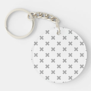 Gray cross stitches on white keychain