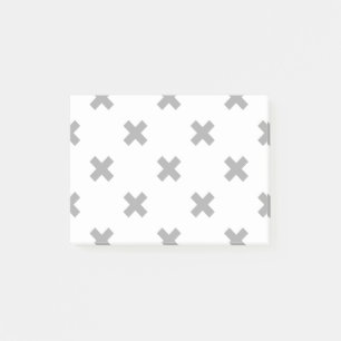 Gray cross stitches on white post-it notes
