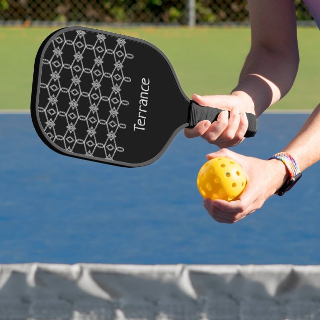 Gray decorative rope fencing black pickleball paddle (Insitu)