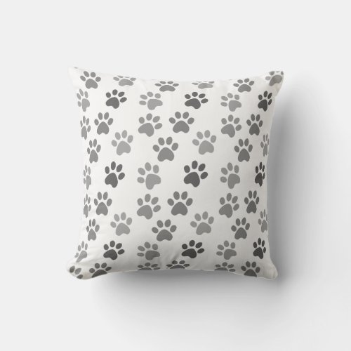 Gray dog  cat paws on white throw pillow