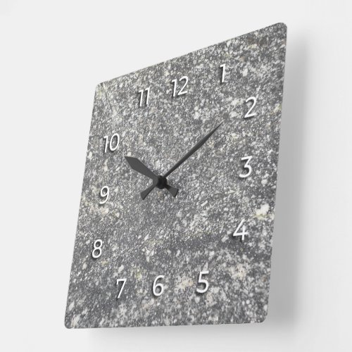 Gray granite interspersed with white elements. square wall clock
