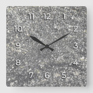 Gray granite interspersed with white elements. square wall clock