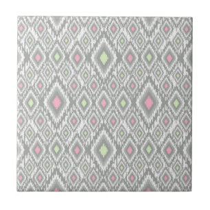 Gray, green, pink rhombuses on a white ceramic tile
