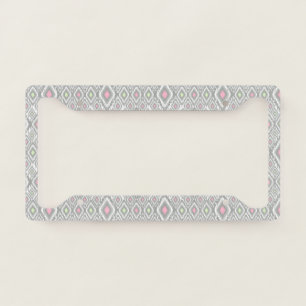 Gray, green, pink rhombuses on a white license plate frame