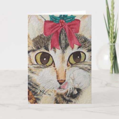 gray kitten licking paws wearing red bow christmas holiday card