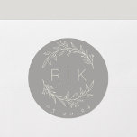 Gray Line Art Botanical Wreath Wedding Monogram Classic Round Sticker<br><div class="desc">Custom-designed wedding monogram stickers featuring elegant hand drawn style white beige botanical wreath with couple's initials and wedding date on gray background. Perfect for wedding save the dates,  envelops,  wedding favor packagings and more.</div>