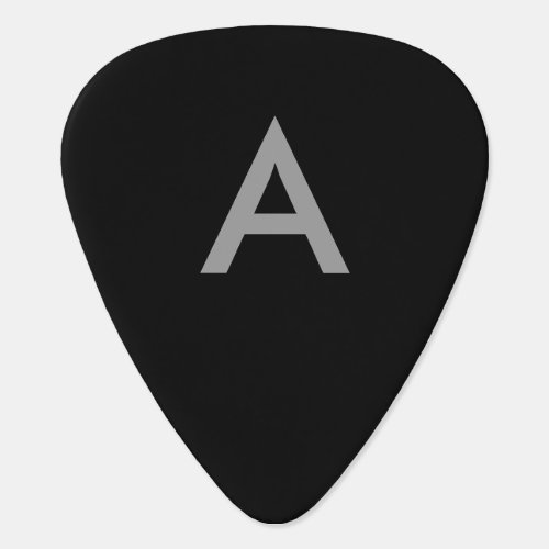 Gray on black initials as letter guitar pick