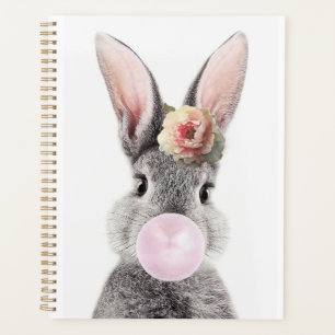 Gray rabbit blowing bubble gum with anemone flower planner