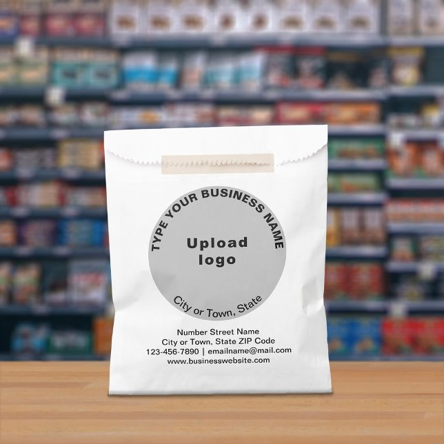 Gray Round Business Brand on Paper Bag (Paper bag with gray round business branding displayed in a store)