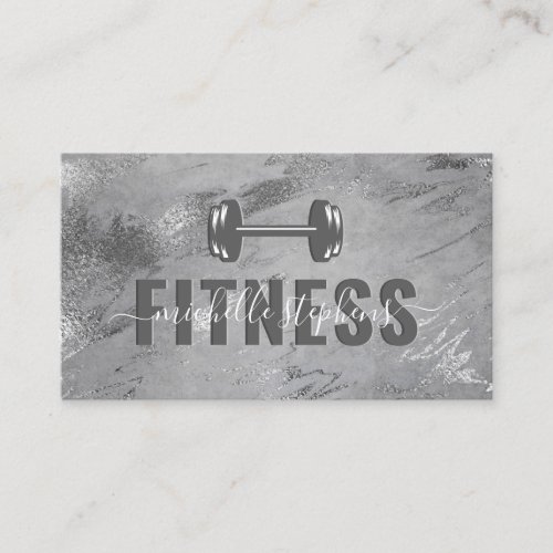 Gray Silver Fitness Trainer Social Media Business Card - Modern PT business cards featuring a rustic gray background with silver foil strokes, gym weights, your name, contact details, and social media icons. The icons can be removed by clicking on personalize and then tap to customize further.