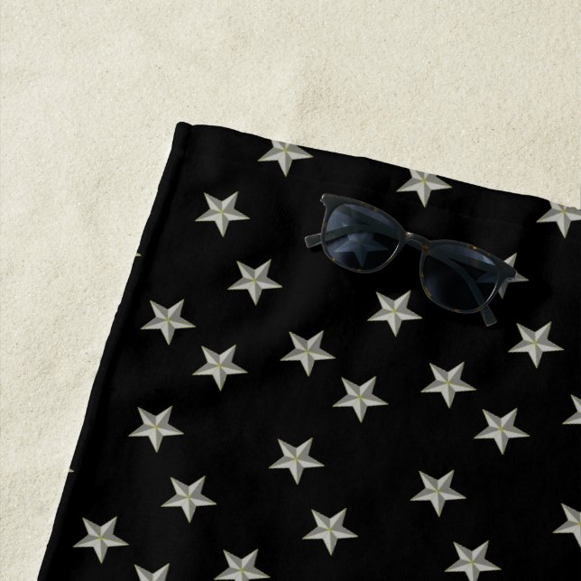 Gray stars pattern on black beach towel (In Situ)
