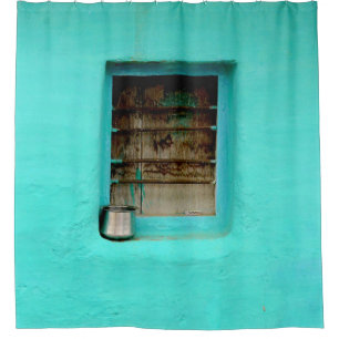 GRAY STEEL CONTAINER ON WINDOW WITH TEAL PAINT SHOWER CURTAIN