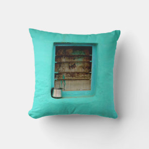 GRAY STEEL CONTAINER ON WINDOW WITH TEAL PAINT THROW PILLOW