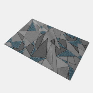 Gray triangle cutouts with rough dark blue pieces doormat