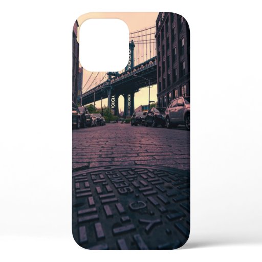 GRAY VEHICLE AT ROAD BESIDE CONCRETE BUILDING iPhone 12 CASE