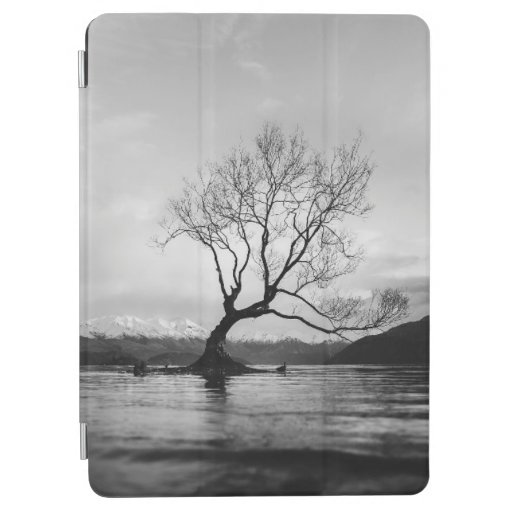 GRAYSCALE PHOTO OF BARE TREE ON CALM BODY OF WATER iPad AIR COVER
