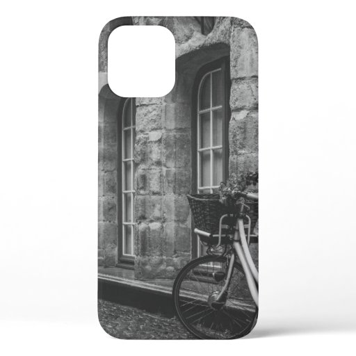 GRAYSCALE PHOTO OF BIKE PARKED BESIDE BUILDING iPhone 12 CASE