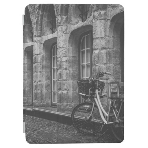 GRAYSCALE PHOTO OF BIKE PARKED BESIDE BUILDING iPad AIR COVER