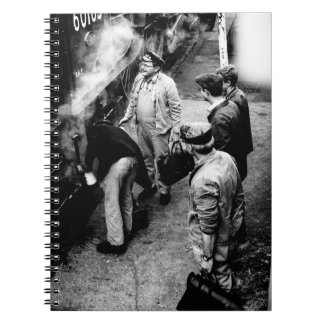 GRAYSCALE PHOTO OF MEN STANDING BESIDE 60163 TRAIN NOTEBOOK