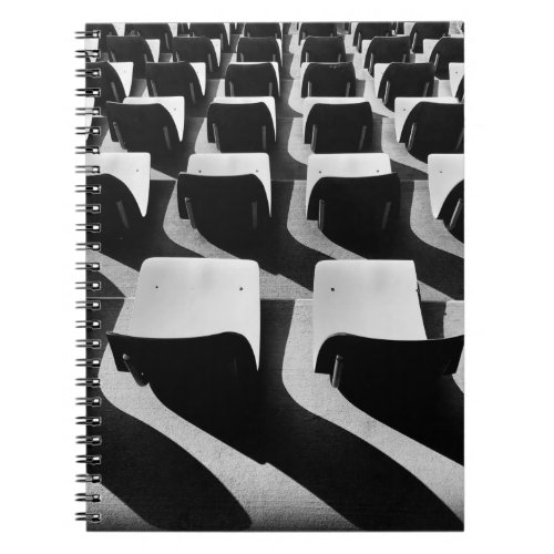 Grayscale photography of chairs with no people notebook