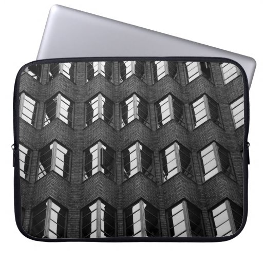 GRAYSCALE PHOTOGRAPHY OF CITY BUILDING LAPTOP SLEEVE