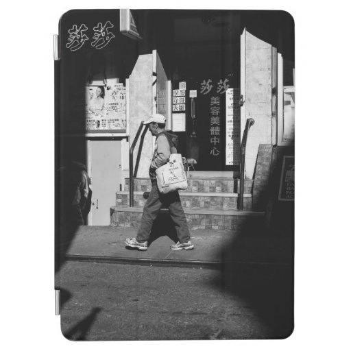 GRAYSCALE PHOTOGRAPHY OF PERSON WALKING BESIDE BUI iPad AIR COVER