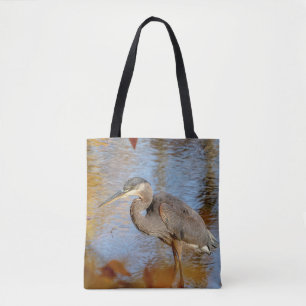 Great Blue Heron framed with fall foliage Tote Bag
