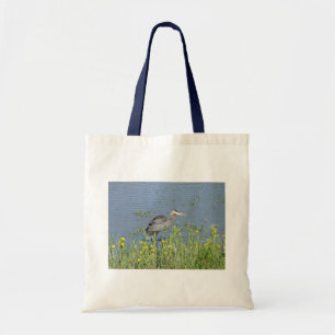 Great Blue Heron in River. Tote Bag