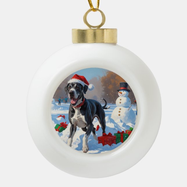 Great Dane Running in Snow with Christmas Hat Ceramic Ball Christmas Ornament (Front)