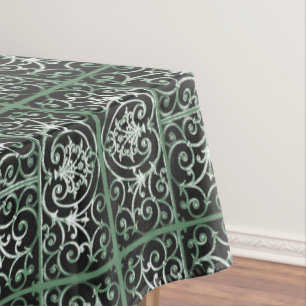Green and black scrollwork pattern tablecloth