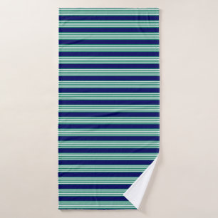 Green and white stripes pattern with navy blue bath towel