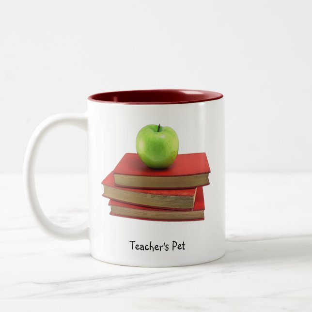 Green Apple and Red Books Teacher's Pet Drinkware Two-Tone Coffee Mug (Left)