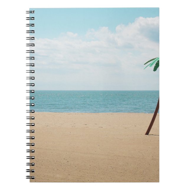 Green artificial palm tree on seashore notebook (Front)