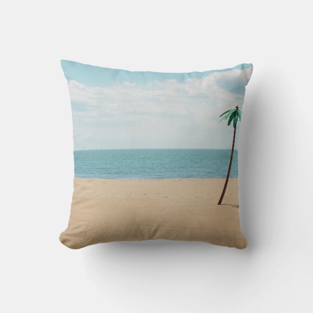 Green artificial palm tree on seashore throw pillow (Front)