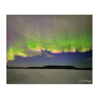 green auroras on a frozen lake acrylic print