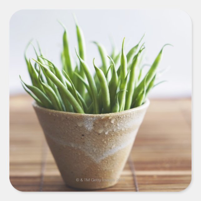 Green beans in pot on bamboo surface square sticker (Front)