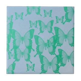 green butterflies in blue background