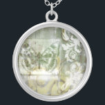 Green Butterfly Inset with Ironwork Gate Silver Plated Necklace<br><div class="desc">Jennifer Goldberger painted this stunning piece. A green butterfly inset rests atop an ironwork gate. A very avant-garde painting,  it has a lot going on that is hidden behind fading colors and splotches of patterns. This would make a great gift for someone who loves modernist art!</div>