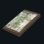 Green Butterfly Inset with Ironwork Gate Trifold Wallet<br><div class="desc">Jennifer Goldberger painted this stunning piece. A green butterfly inset rests atop an ironwork gate. A very avant-garde painting,  it has a lot going on that is hidden behind fading colors and splotches of patterns. This would make a great gift for someone who loves modernist art!</div>