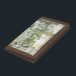 Green Butterfly Inset with Ironwork Gate Trifold Wallet<br><div class="desc">Jennifer Goldberger painted this stunning piece. A green butterfly inset rests atop an ironwork gate. A very avant-garde painting,  it has a lot going on that is hidden behind fading colors and splotches of patterns. This would make a great gift for someone who loves modernist art!</div>
