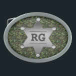 Green Camouflage Pattern Sheriff Badge Monogram Oval Belt Buckle<br><div class="desc">This customizable camo pattern design has a metal sheriff badge with space for you to add your monogram / initials or other text. The camouflage is in shades of green and brown. It's a great design for a person in the military, a veteran, a woman or man in law enforcement,...</div>
