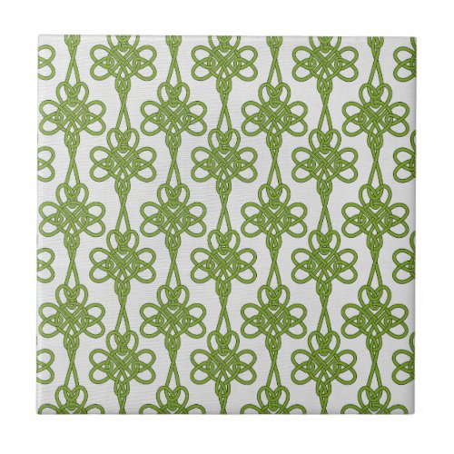 Green Celtic Knot Design on White Ceramic Tile