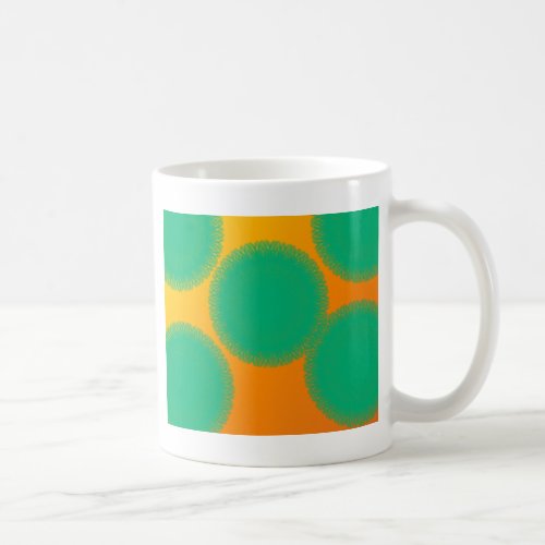 green circle in yellowish orange coffee mug
