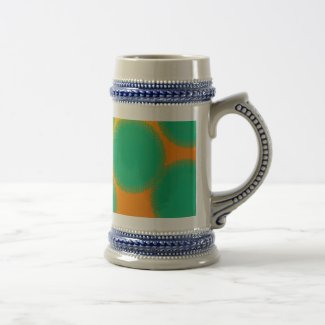 green circle in yellowish orange travel mug