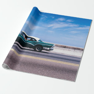 Green coupe on gray asphalt road wrapping paper
