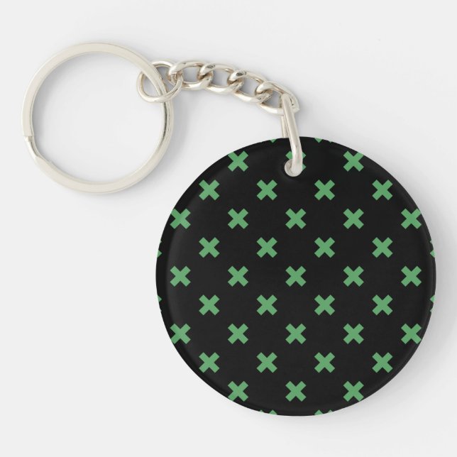 Green cross stitches on black keychain (Front)