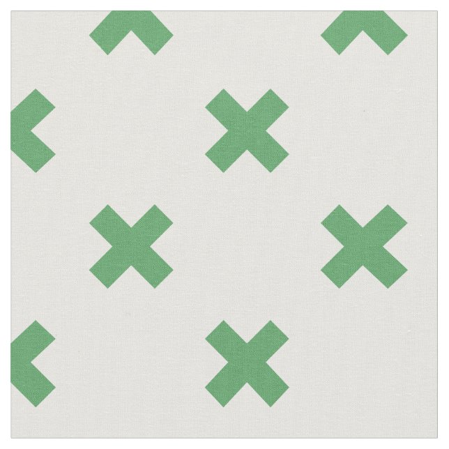 Green cross stitches on white fabric (Close Up)