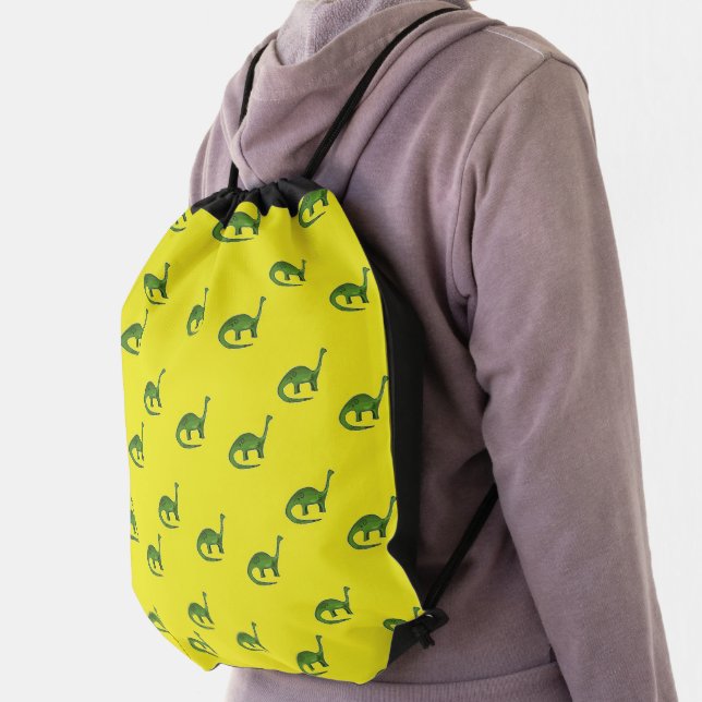 Green dinosaurs on yellow pattern drawstring bag (Insitu)