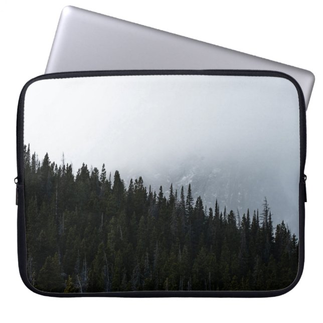 GREEN EVERGREEN TREES UNDER A CLOUDY SKY LAPTOP SLEEVE (Front)
