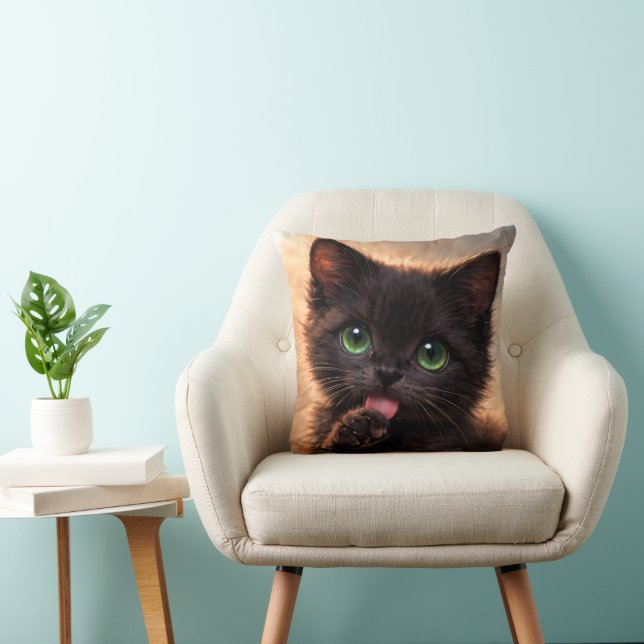 Green-Eyed Black Paw licking Kitten Throw Pillow (Chair)